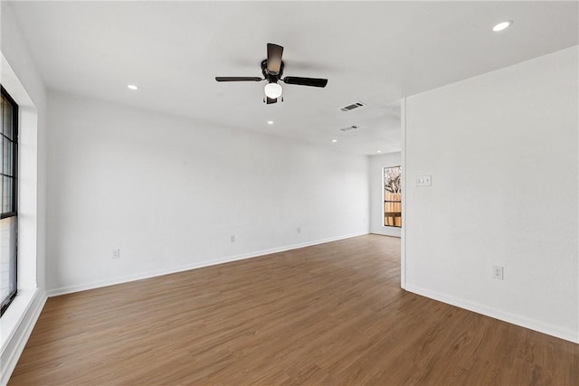 unfurnished room featuring hardwood / wood-style floors and ceiling fan