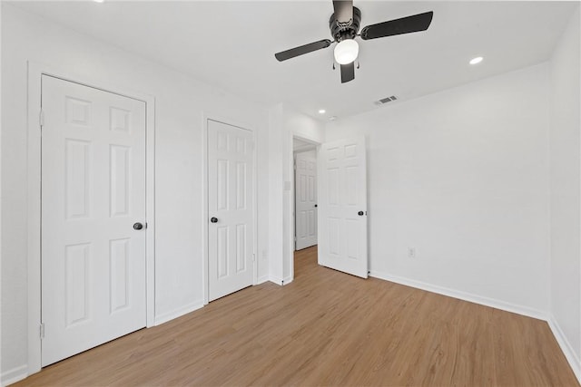 unfurnished bedroom with light hardwood / wood-style flooring and ceiling fan