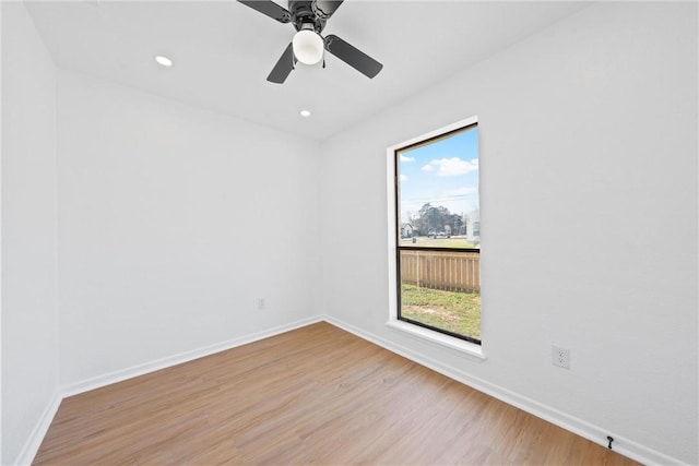 spare room featuring ceiling fan and light wood-type flooring