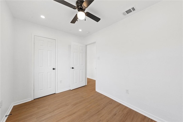 unfurnished bedroom featuring ceiling fan and light hardwood / wood-style floors