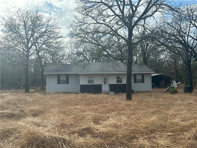 rear view of house featuring a carport