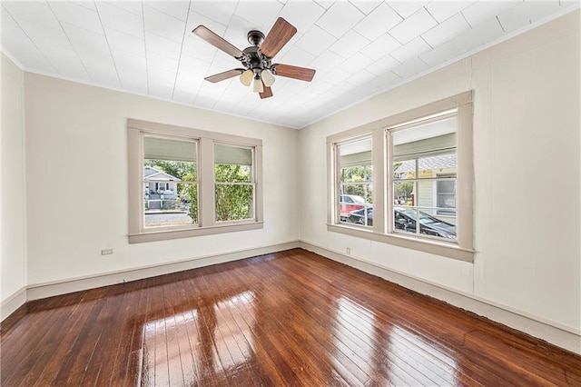 spare room with ceiling fan, wood-type flooring, and ornamental molding