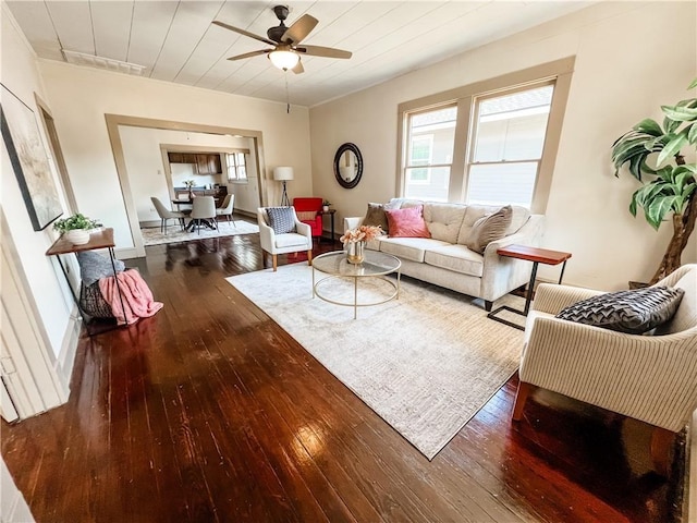 living room featuring ceiling fan and wood-type flooring