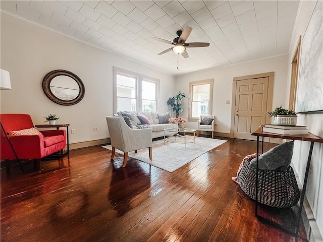 living room with ceiling fan, ornamental molding, and hardwood / wood-style flooring