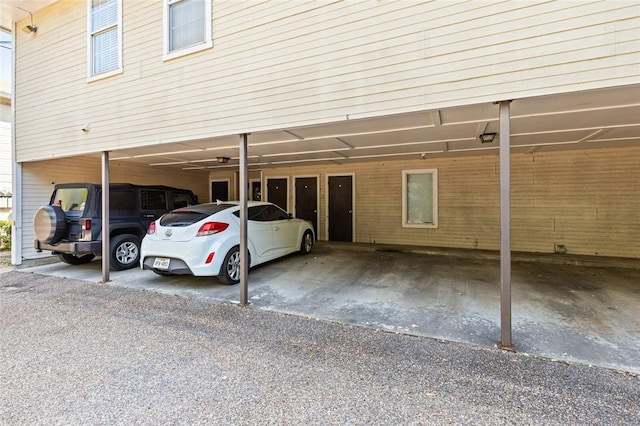 view of vehicle parking featuring a carport