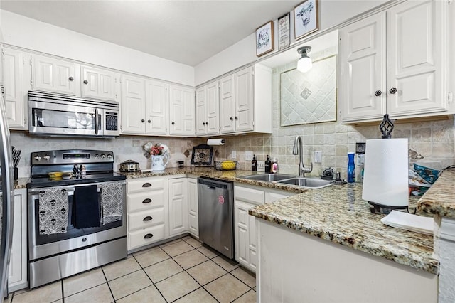 kitchen featuring sink, white cabinets, and stainless steel appliances