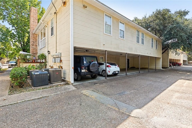 exterior space featuring a carport and central AC