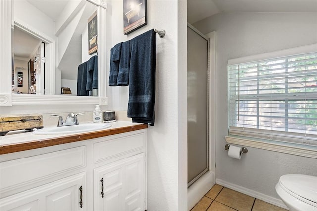 bathroom featuring tile patterned flooring, toilet, an enclosed shower, and lofted ceiling