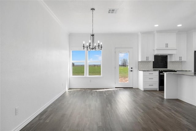 kitchen with tasteful backsplash, visible vents, dark wood finished floors, and white cabinets