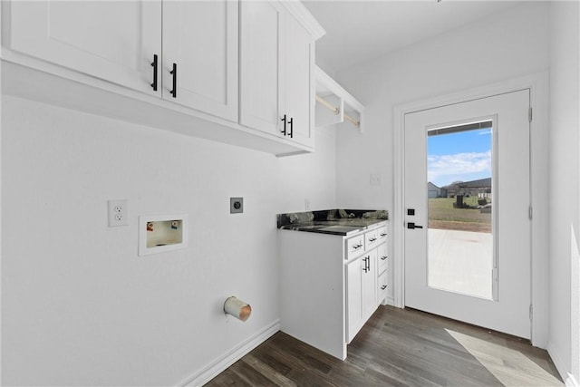 laundry room with hookup for a washing machine, baseboards, hookup for an electric dryer, cabinet space, and dark wood-style flooring