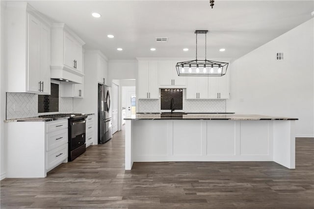 kitchen featuring visible vents, black gas stove, white cabinetry, and stainless steel fridge with ice dispenser