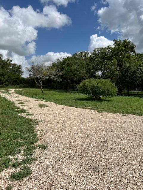 surrounding community featuring a lawn