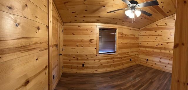 interior space with hardwood / wood-style floors, lofted ceiling, wooden walls, and wood ceiling