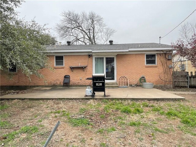 back of property with a patio area