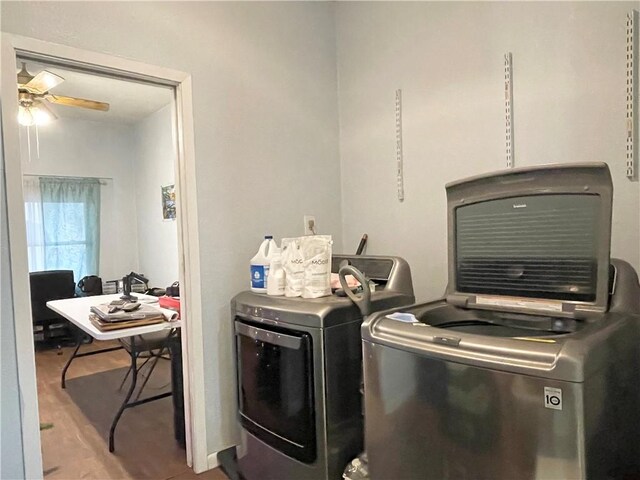 laundry area featuring separate washer and dryer, hardwood / wood-style flooring, and ceiling fan