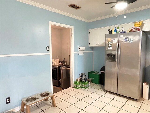 kitchen with stainless steel refrigerator with ice dispenser, washer and dryer, ornamental molding, ceiling fan, and white cabinets