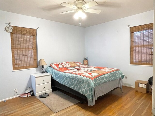 bedroom featuring ceiling fan and light hardwood / wood-style floors