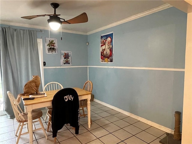 dining area featuring crown molding, ceiling fan, and tile patterned floors