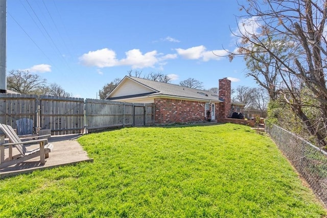 view of yard with a patio area and a fenced backyard