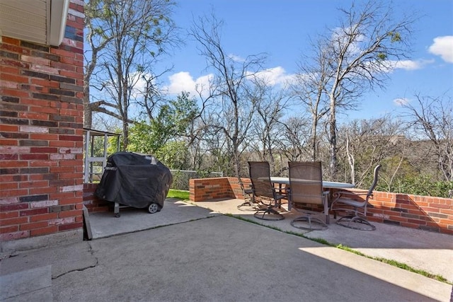 view of patio / terrace with outdoor dining area and a grill