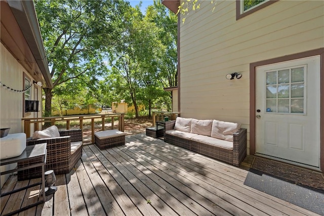 deck featuring outdoor lounge area