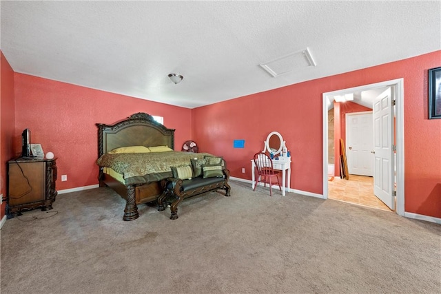 bedroom with light colored carpet and a textured ceiling