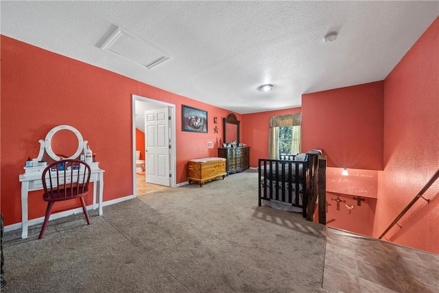 bedroom with carpet flooring and a textured ceiling