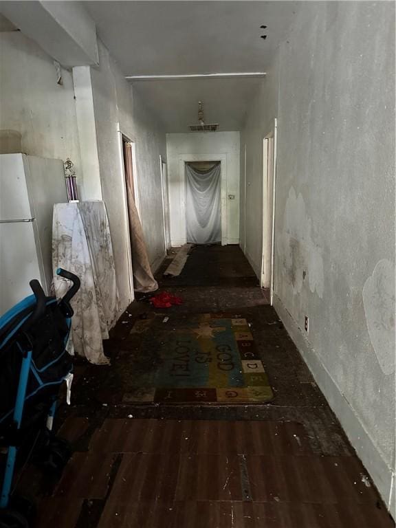 hallway with dark hardwood / wood-style flooring