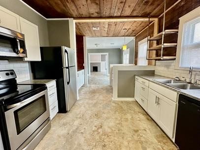 kitchen with wood ceiling, stainless steel appliances, decorative light fixtures, and backsplash