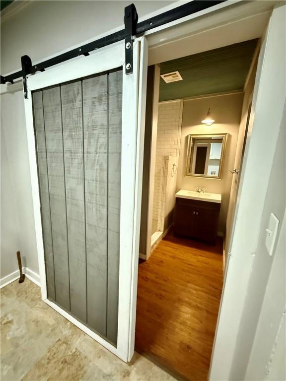 bathroom featuring vanity and hardwood / wood-style floors