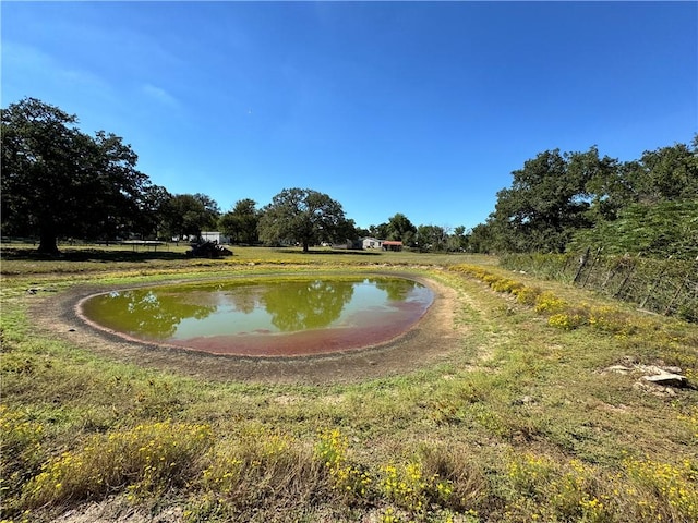 surrounding community with a water view