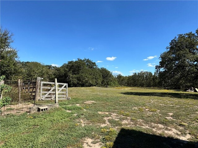 view of yard with a rural view