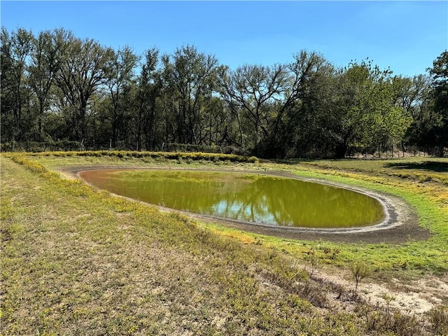 surrounding community featuring a water view