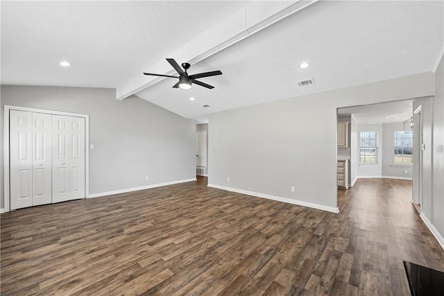 unfurnished living room with dark hardwood / wood-style flooring, lofted ceiling with beams, and ceiling fan