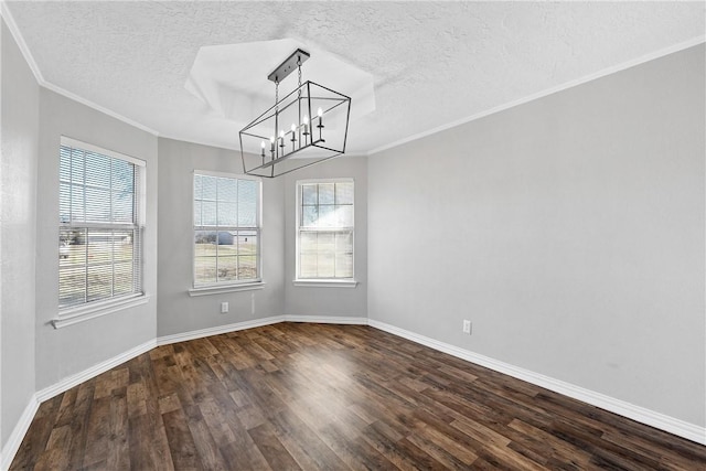 unfurnished dining area featuring a textured ceiling, crown molding, dark wood-type flooring, and a chandelier