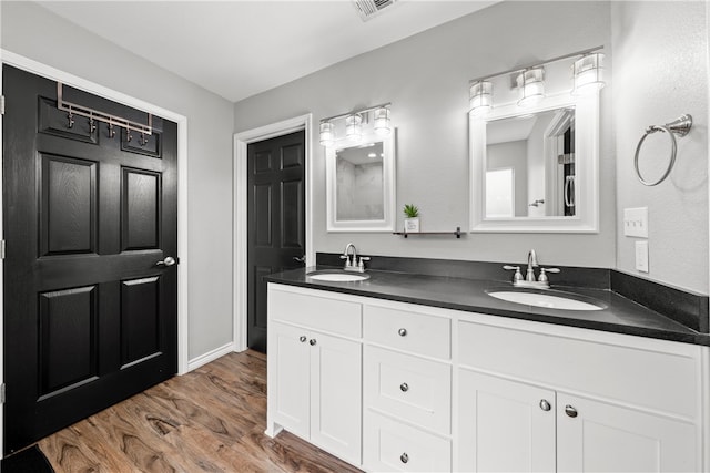 bathroom featuring vanity and hardwood / wood-style floors