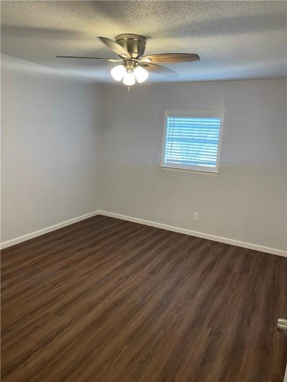 spare room featuring a textured ceiling, dark hardwood / wood-style flooring, and ceiling fan