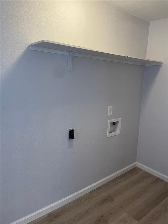 laundry room with washer hookup and dark wood-type flooring