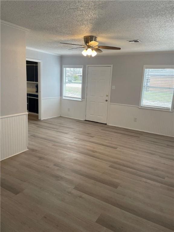 unfurnished room with hardwood / wood-style flooring and ceiling fan