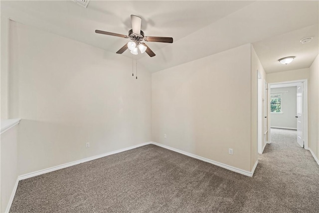 carpeted empty room with ceiling fan and lofted ceiling