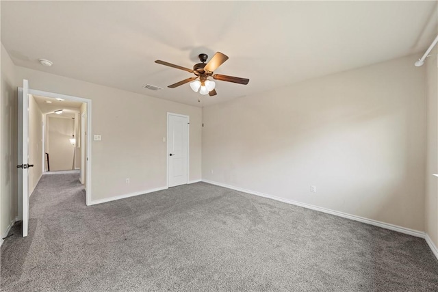 unfurnished bedroom featuring ceiling fan and dark carpet