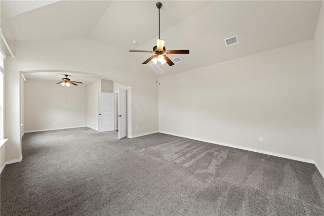 unfurnished room featuring ceiling fan, dark carpet, and vaulted ceiling