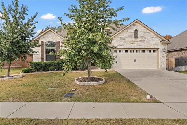 view of front of home with a garage and a front yard