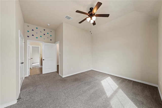 unfurnished bedroom with carpet, ceiling fan, and vaulted ceiling