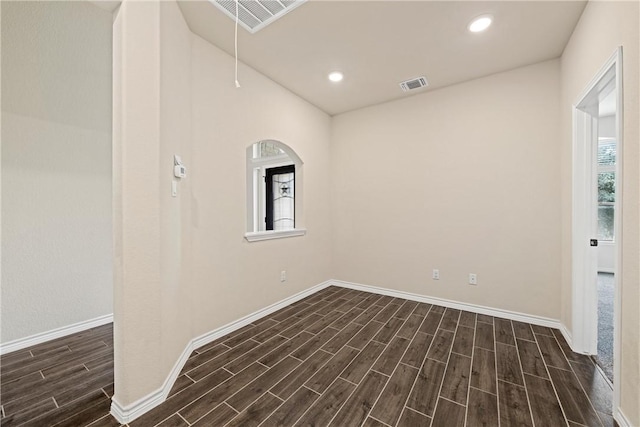 empty room with dark hardwood / wood-style floors