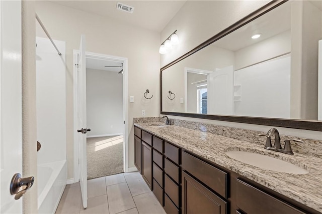 bathroom featuring tile patterned floors, vanity, and bathtub / shower combination