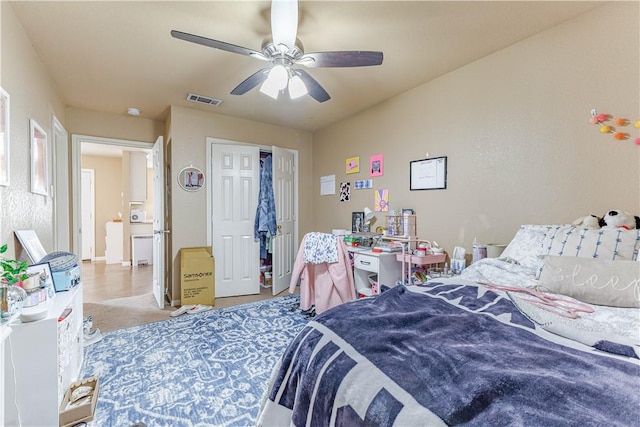 bedroom featuring carpet, visible vents, and a ceiling fan