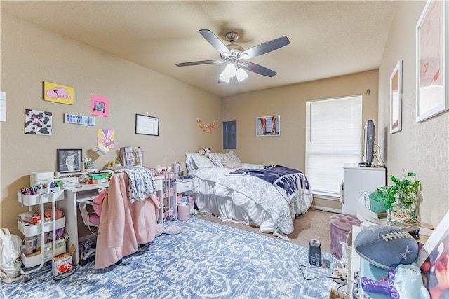 carpeted bedroom with electric panel and ceiling fan