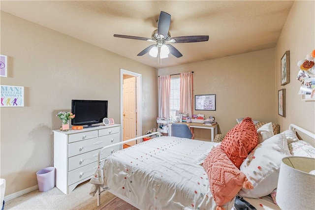 bedroom with baseboards, ceiling fan, and light colored carpet