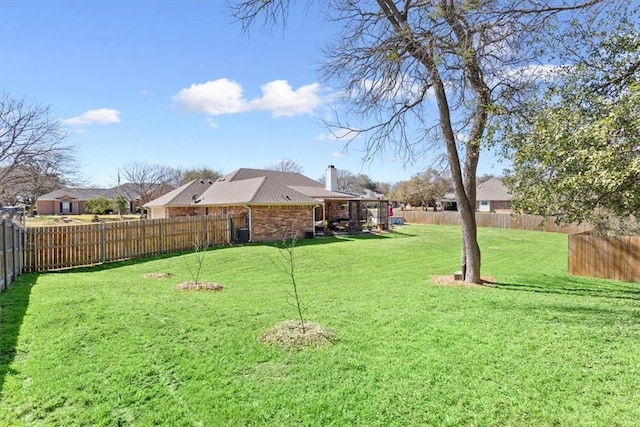 view of yard with a fenced backyard